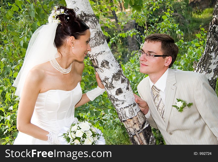 Newlywedses on walk in park. Newlywedses on walk in park