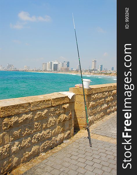 Fishing pole with Tel Aviv Israel in background