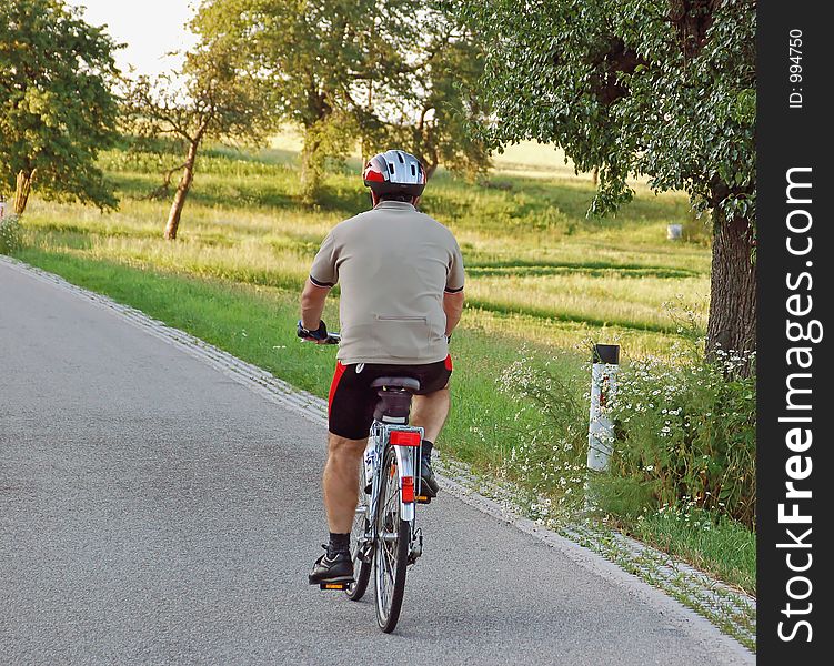 A senior man drive with his bycicle. A senior man drive with his bycicle