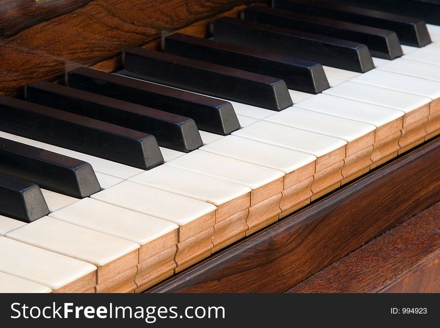 Details of an antique square piano keyboard. Details of an antique square piano keyboard