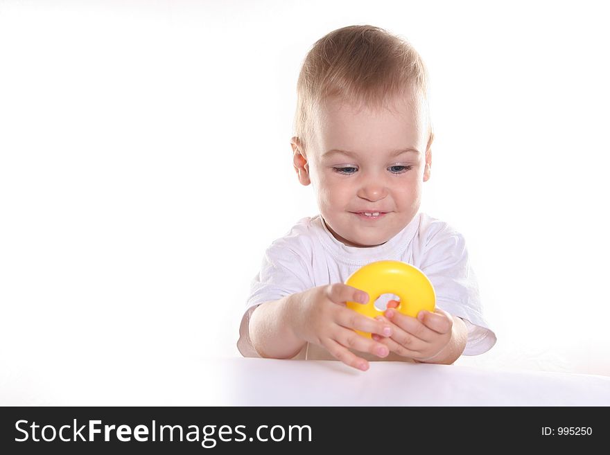 Baby with toy ring isolated