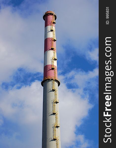 Chimney of a factory and blue sky