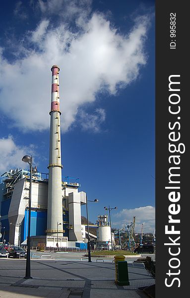 Chimney of a factory and blue sky