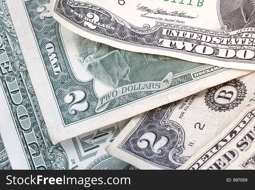 Pile of two dollar bills (and a one dollar bill) - horizontal format. Pile of two dollar bills (and a one dollar bill) - horizontal format