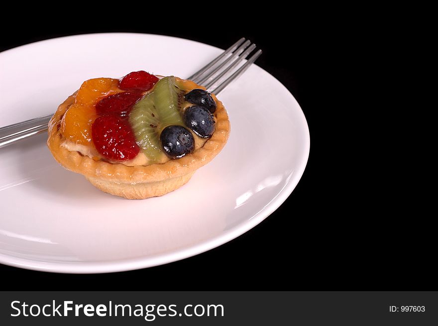 Fruit tart on white plate. Fruit tart on white plate