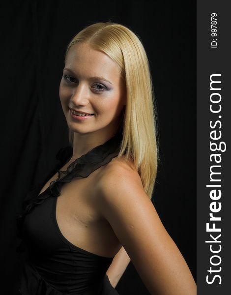 Attractive blond model on black background