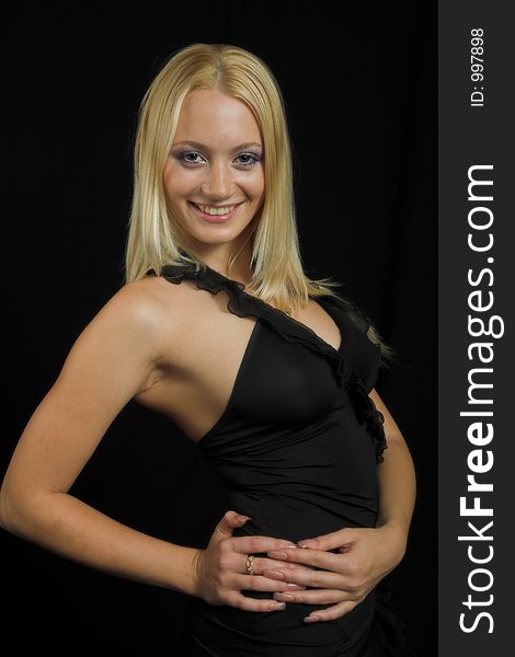 Attractive blond model on black background - black dress - very high resolution