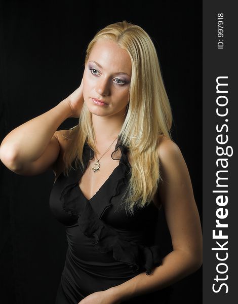 Attractive blond model on black background