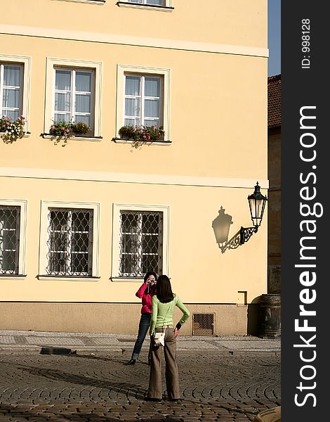 Automn in prag in tcheck republic, houses and buildings, woman in a street