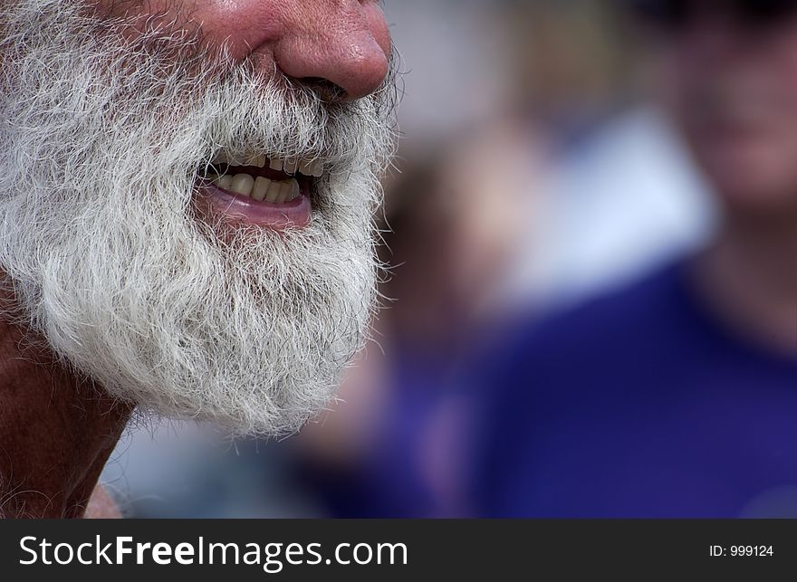 Close up of a man with a grey beard. Close up of a man with a grey beard