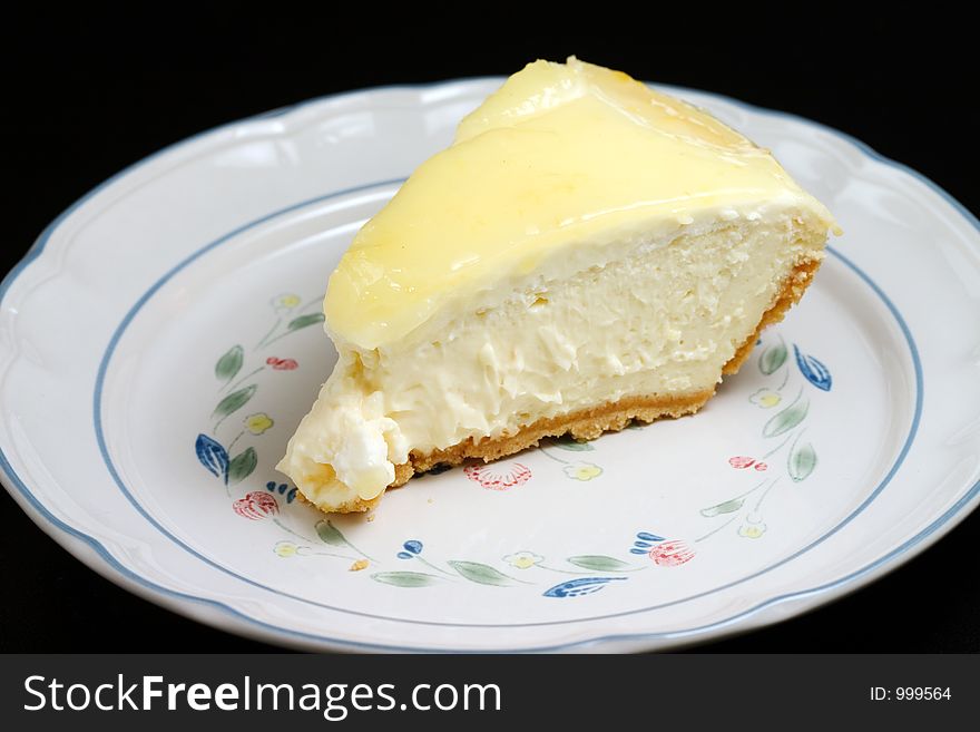 Lemon glazed cheesecake on a plate