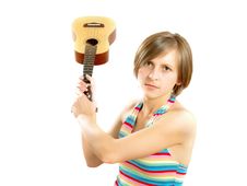 Angry Young Blond Lady Fighting With A Guitar Stock Photo Angry Young Blond Lady Fighting With A Guitar Stock Photo