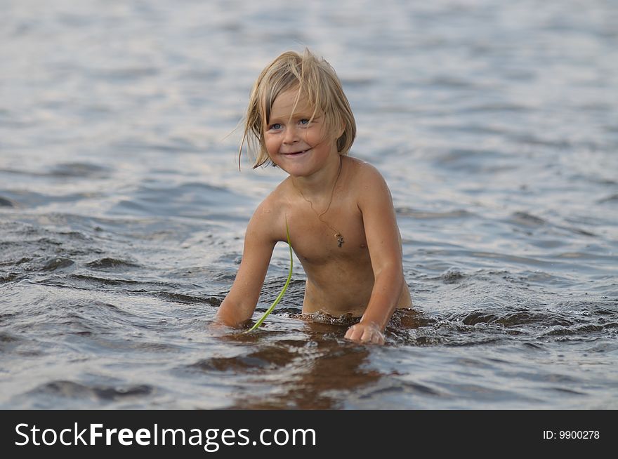 Photo of the little girl in the river. Photo of the little girl in the river