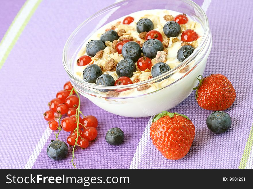 Bowl of corn flakes with fresh fruits and jogurt. Bowl of corn flakes with fresh fruits and jogurt