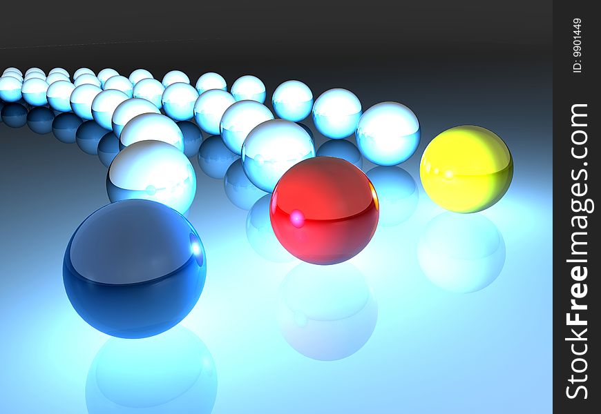 Three colored balls on reflective ground