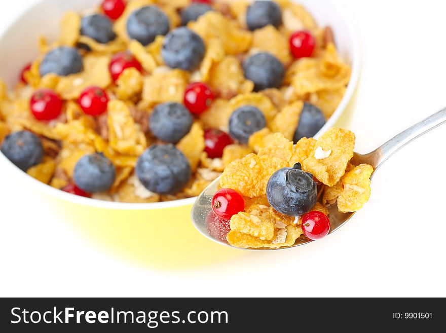 Bowl of corn flakes with fresh fruits. Bowl of corn flakes with fresh fruits