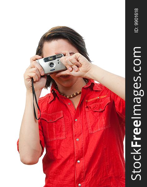 Young guy photographs something. Isolated over white in studio.