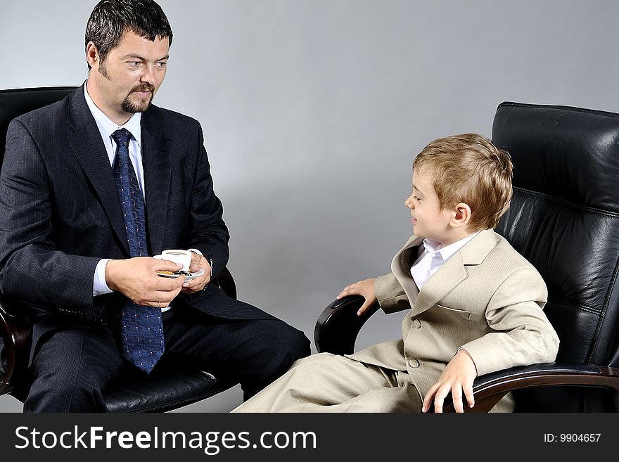 Man and boy discussing important problems about the future. Man and boy discussing important problems about the future