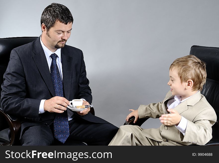 Man and boy discussing important problems about the future. Man and boy discussing important problems about the future