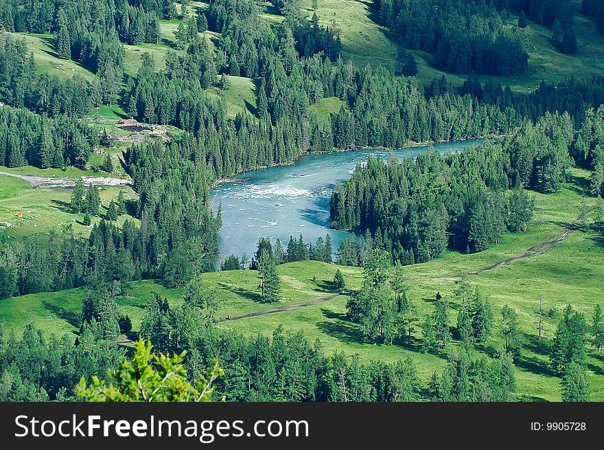 A meandering river through Forests and fields. A meandering river through Forests and fields