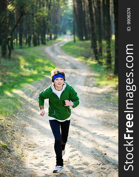 Girl runner in the forest