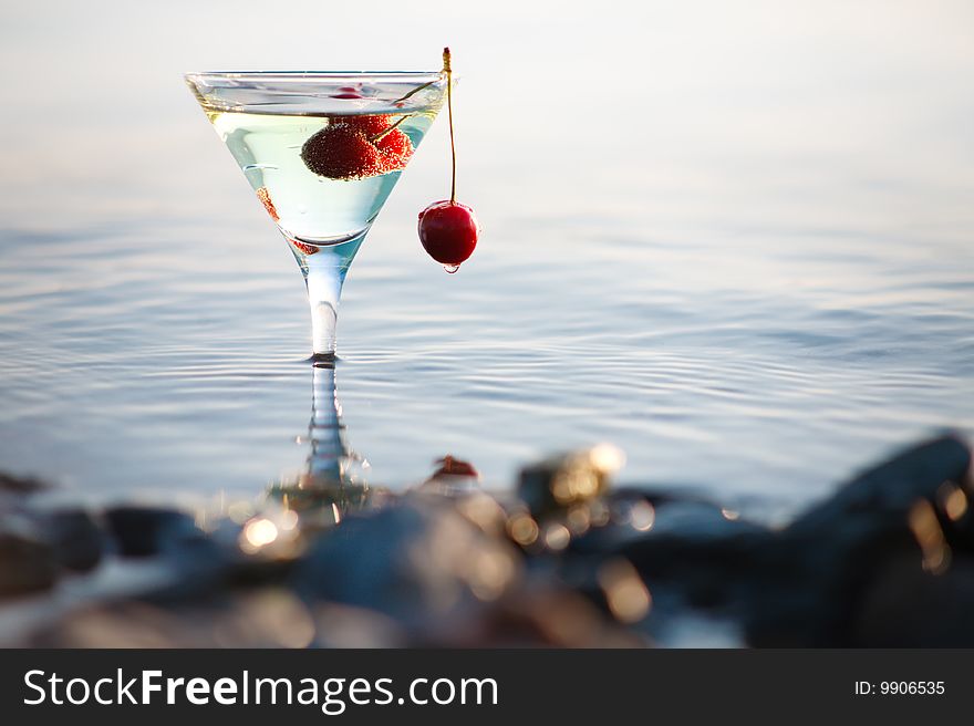 Image of  martini glass  with cherry in water