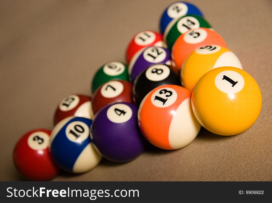 Fifteen balls over a billard table. Racked and ready to go!