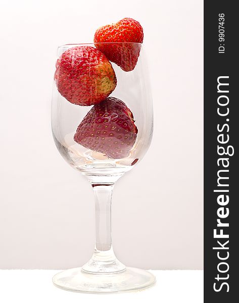 Three Strawberries In A Glass