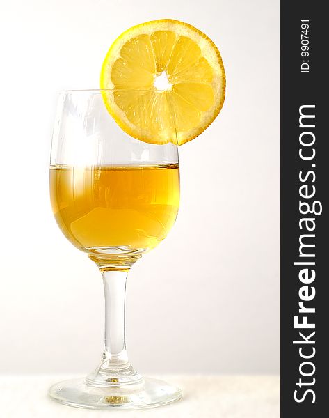 The drink in the glass with an orange