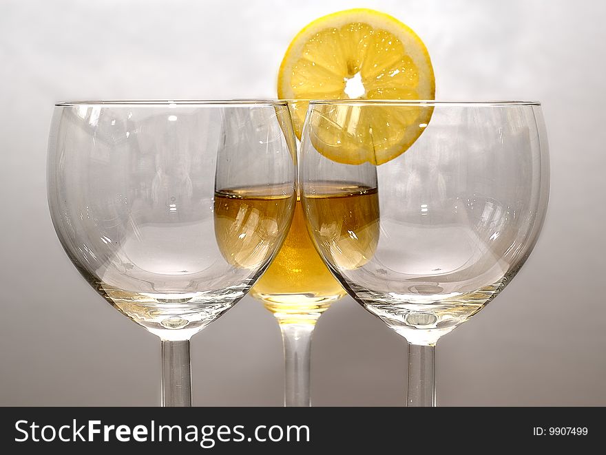 The drink in the glass with a fresh orange. The drink in the glass with a fresh orange