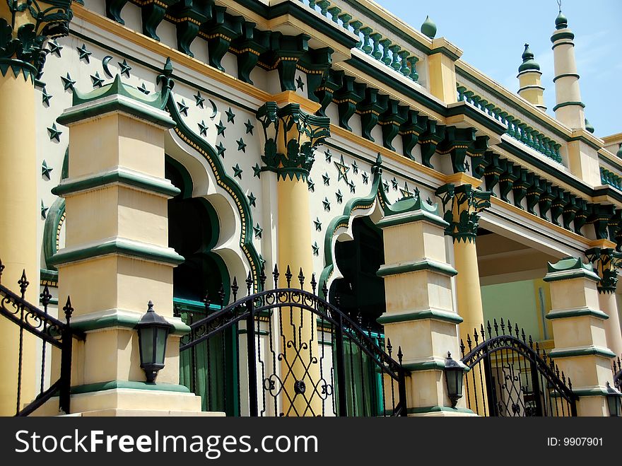 Exterior wall with distinctive Moorish windows, Islamic stars, and designs at the 1907 Abdul Gaffor Mosque in Little India - Xu Lei Photo / Lee Snider Photo Images. Exterior wall with distinctive Moorish windows, Islamic stars, and designs at the 1907 Abdul Gaffor Mosque in Little India - Xu Lei Photo / Lee Snider Photo Images.