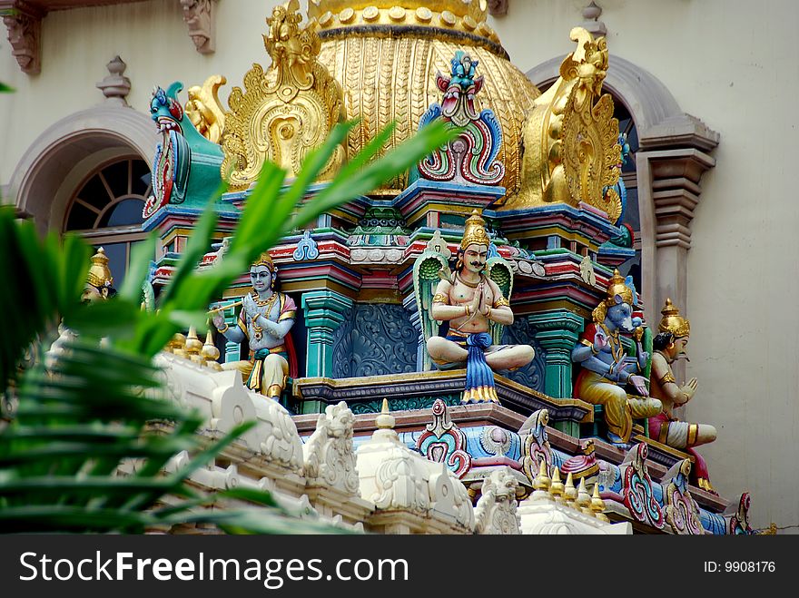 Ornate, gilded dome and Hindu deities decorate roof of the Sri Krishnan temple on the Albert Mall - Xu Lei Photo / Lee Snider Photo Images. Ornate, gilded dome and Hindu deities decorate roof of the Sri Krishnan temple on the Albert Mall - Xu Lei Photo / Lee Snider Photo Images.