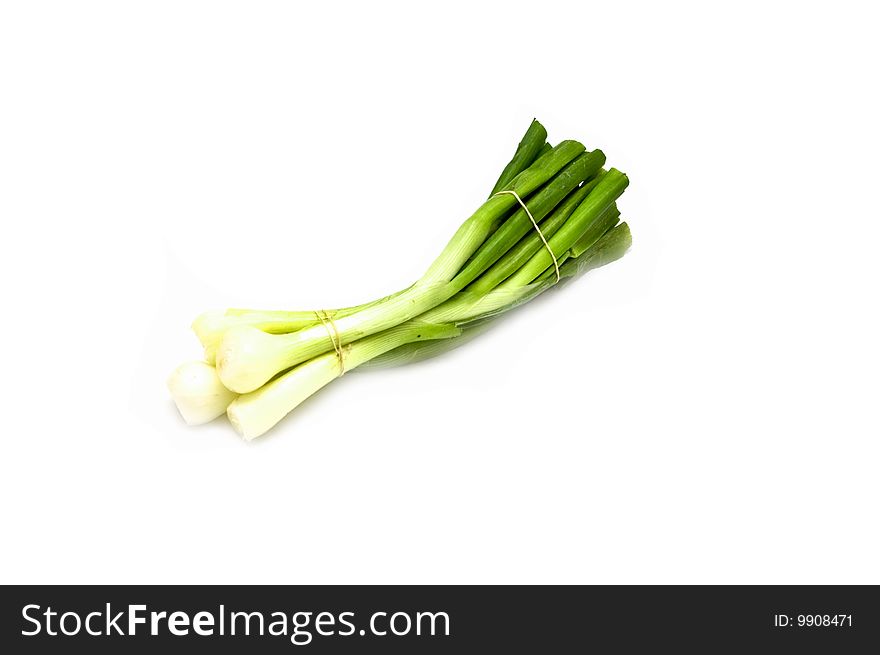 Bunch of spring onion on white