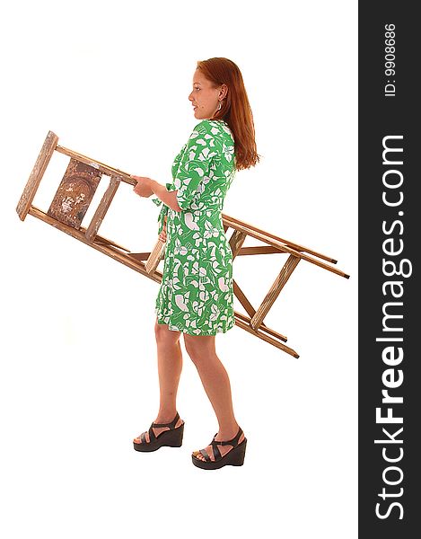 Young woman in green dress and high heels caring a stepladder,
for white background. Young woman in green dress and high heels caring a stepladder,
for white background.