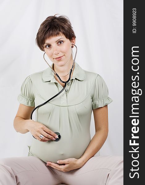 Pregnant female on a white background