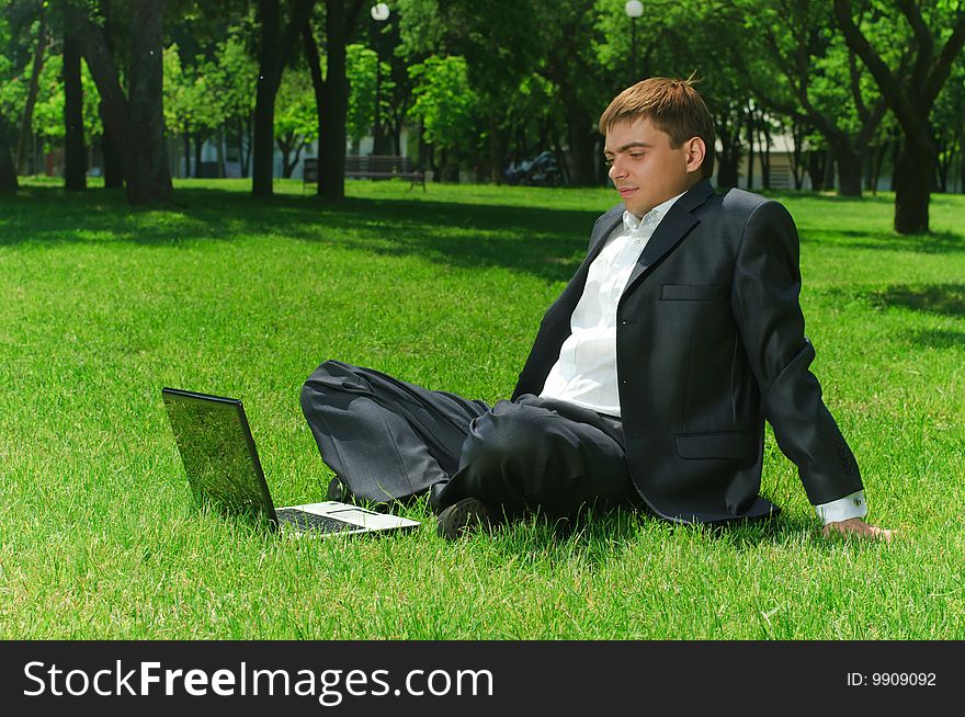 Young businessman in the park