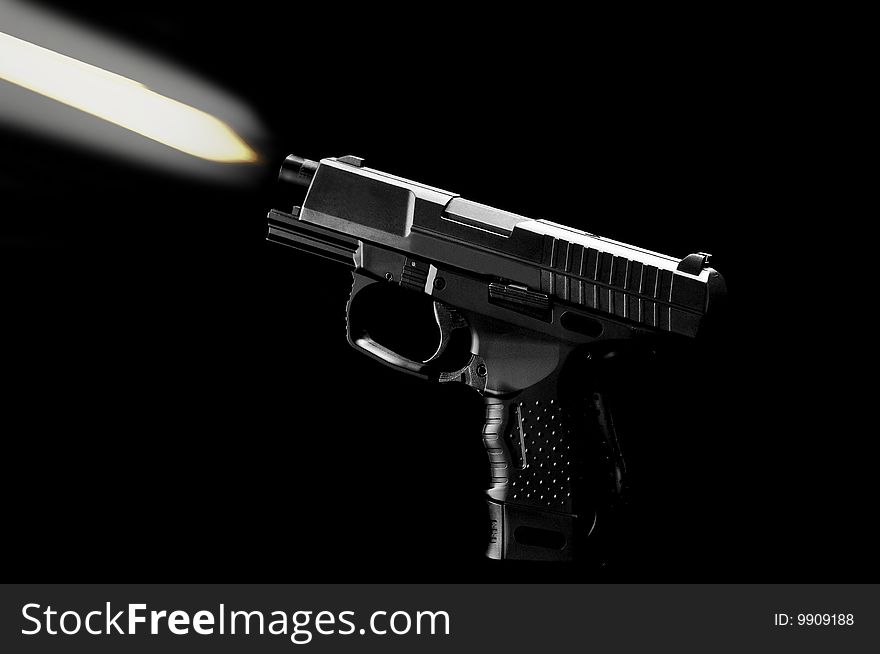 The black gun isolated on black background