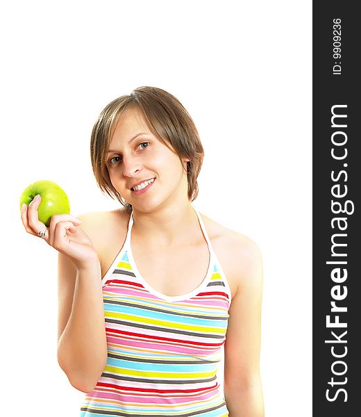 Portrait of an attractive Caucasian blond girl with a nice colorful striped dress who is smiling and she is holding a green apple in her hand. Isolated on white. Portrait of an attractive Caucasian blond girl with a nice colorful striped dress who is smiling and she is holding a green apple in her hand. Isolated on white.