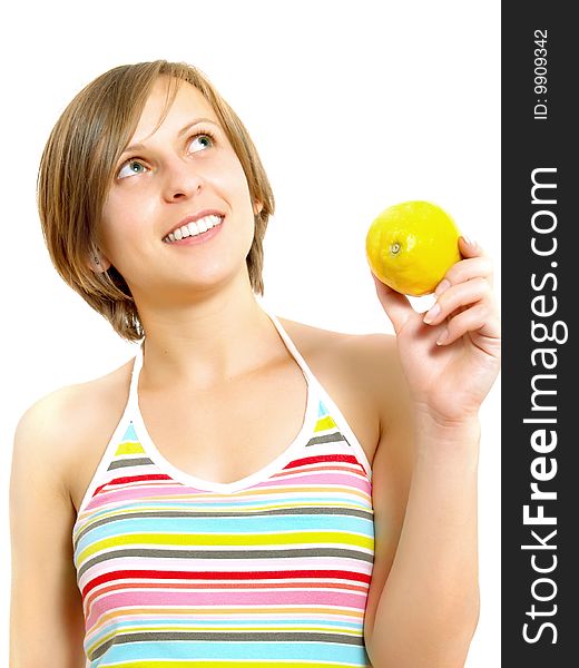 Portrait of an attractive Caucasian blond girl with a nice colorful striped summer dress who is smiling and she is holding a fresh lemon in her hand. Isolated on white. Portrait of an attractive Caucasian blond girl with a nice colorful striped summer dress who is smiling and she is holding a fresh lemon in her hand. Isolated on white.