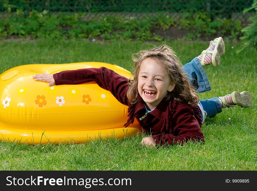 Photography of young girl lies on the grass