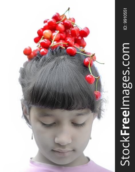 Little girl with cherry on her head. Little girl with cherry on her head