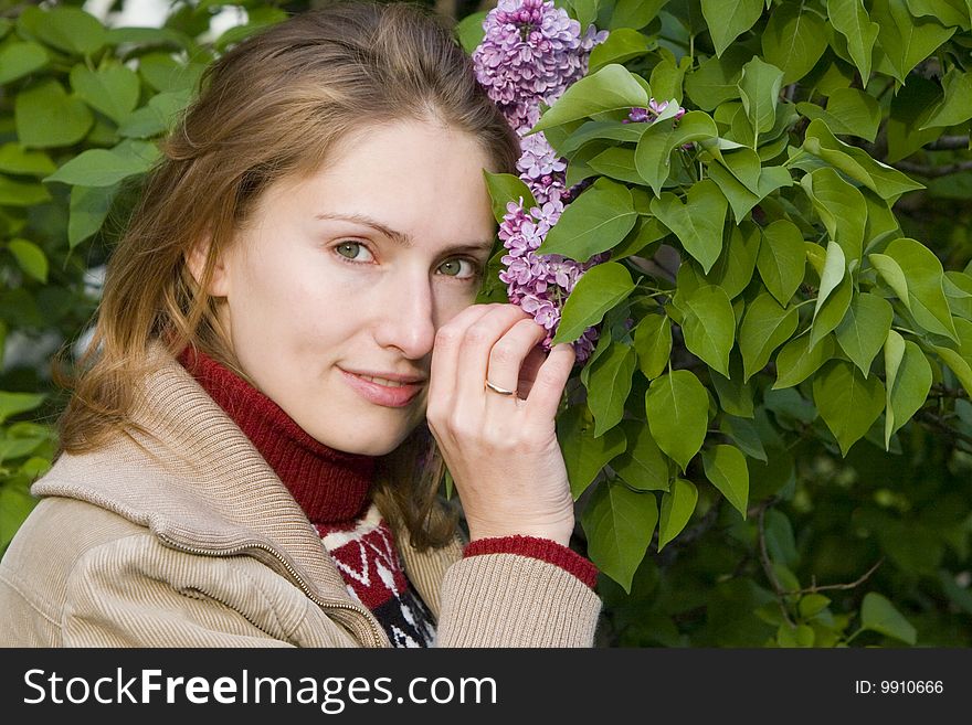 A young woman and lilac