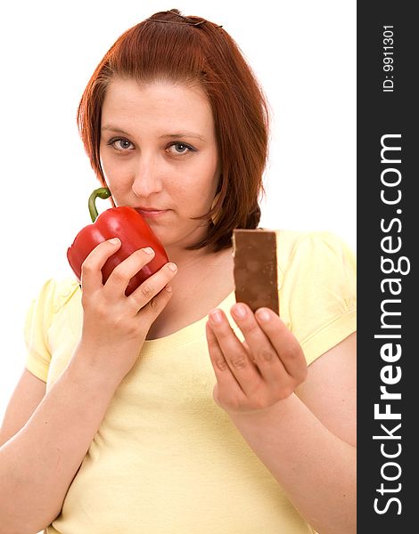 Woman eating vegetables on white background