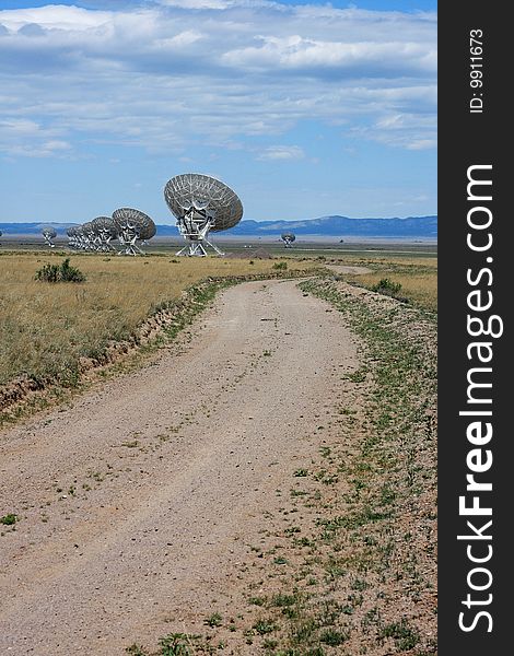 Very Large Array against blue clouded sky. Very Large Array against blue clouded sky.