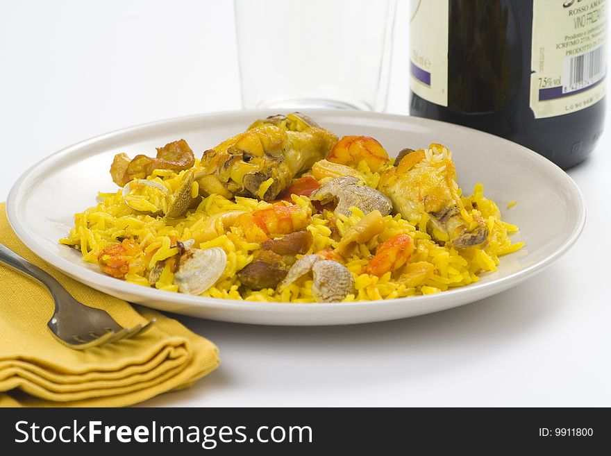 Delicious seafood paella and chicken rice yellow isolated