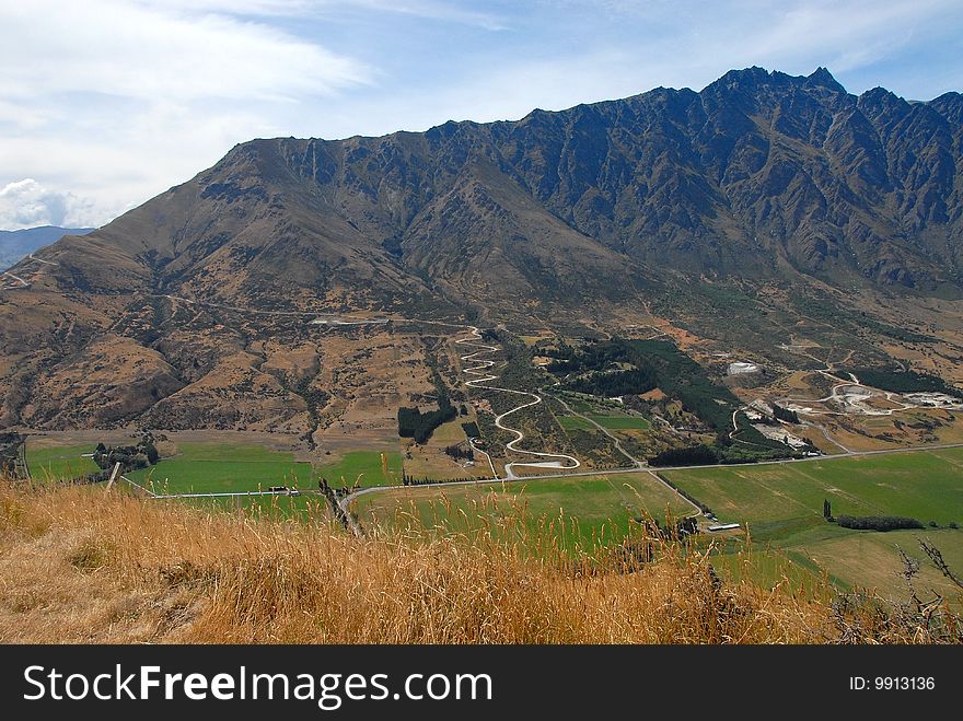 Remarkables Mountain Range, Queenstown, New Zealand taken from Kelvin Heights. Zig zag road leads up to renowned ski field. Remarkables Mountain Range, Queenstown, New Zealand taken from Kelvin Heights. Zig zag road leads up to renowned ski field