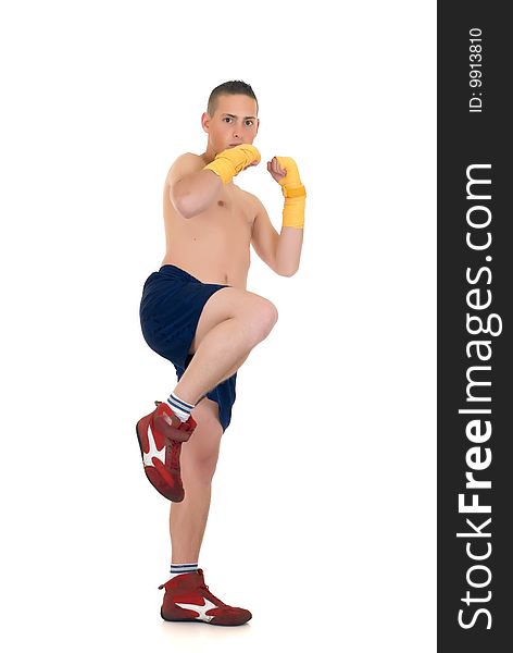 Youngster practicing the art of boxing, studio shot on white background