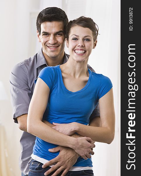Attractive Brunette couple standing in embrace. vertical. Attractive Brunette couple standing in embrace. vertical