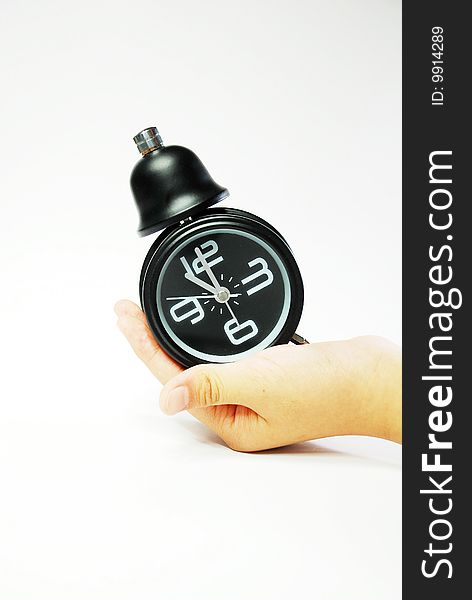 Black alarm clock on the white background. Black alarm clock on the white background