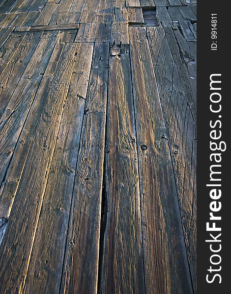 Close up of wooden planks of a jetty/quay. Close up of wooden planks of a jetty/quay